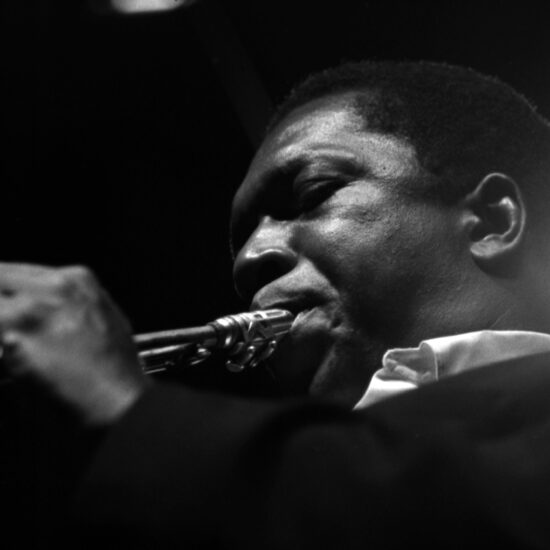 A close-up of American jazz saxophonist, bandleader and composer John Coltrane as he plays on stage at the Newport Jazz Festival, Rhode Island, July 1965