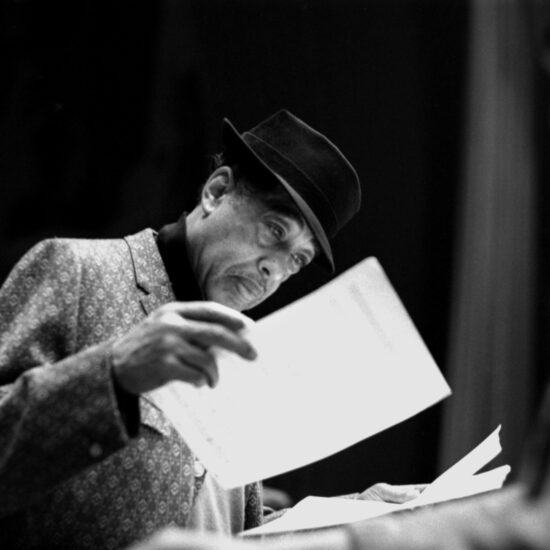 American composer, pianist, and bandleader Duke Ellington looks at sheet music during band rehearsals before a performance at The Astoria, Finsbury Park, London circa 1962