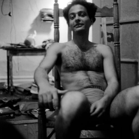The Italian-American poet, publisher, actor and filmmaker Piero Heliczer relaxes in his underpants in his apartment in New York, circa 1965