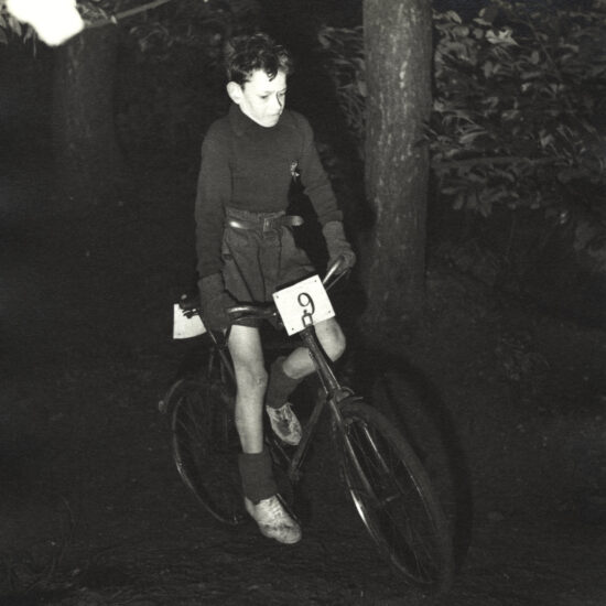 John Hoppy Hopkins at Caldicott School bicycle cross country race, sporting number 9, circa 1946-9