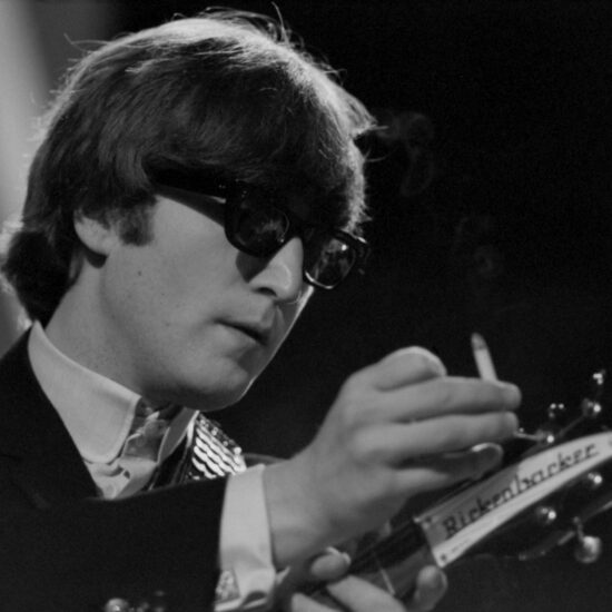 John Lennon smokes whilst The Beatles rehearse for ABC's TV show 'Thank Your Lucky Stars', Teddington Studios in 1964